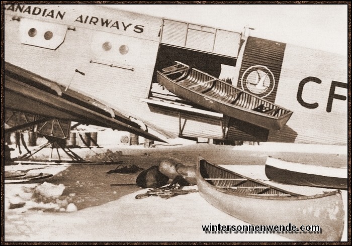 Auch im englischen Hoheitsgebiet Kanada kann man nicht auf die Hilfe deutscher
Flugzeuge verzichten. Hier werden Kanus in Kanada in eine deutsche 
Junkers-Maschine, Ju 52, verladen.