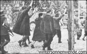 Germans are led to run the gauntlet.
